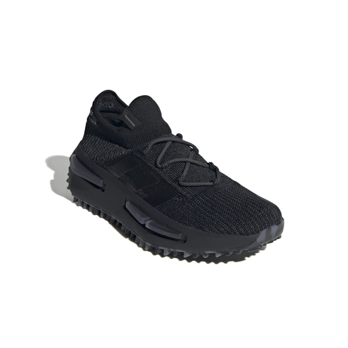 Black monochrome knit trainer with molded overlays and grippy outsole