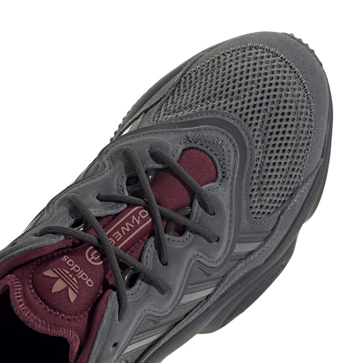 Grey mesh sneaker toe and lace area with burgundy inner panel