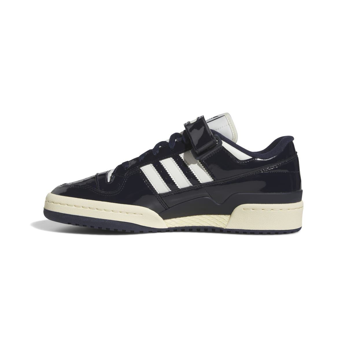 Dark navy adidas low-top trainers with white stripes, hook-and-loop strap, and off-white sole