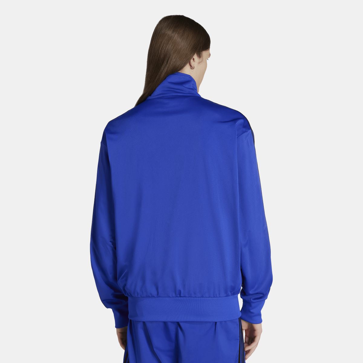 Blue adidas Firebird track jacket, back view with stand collar and black sleeve stripes