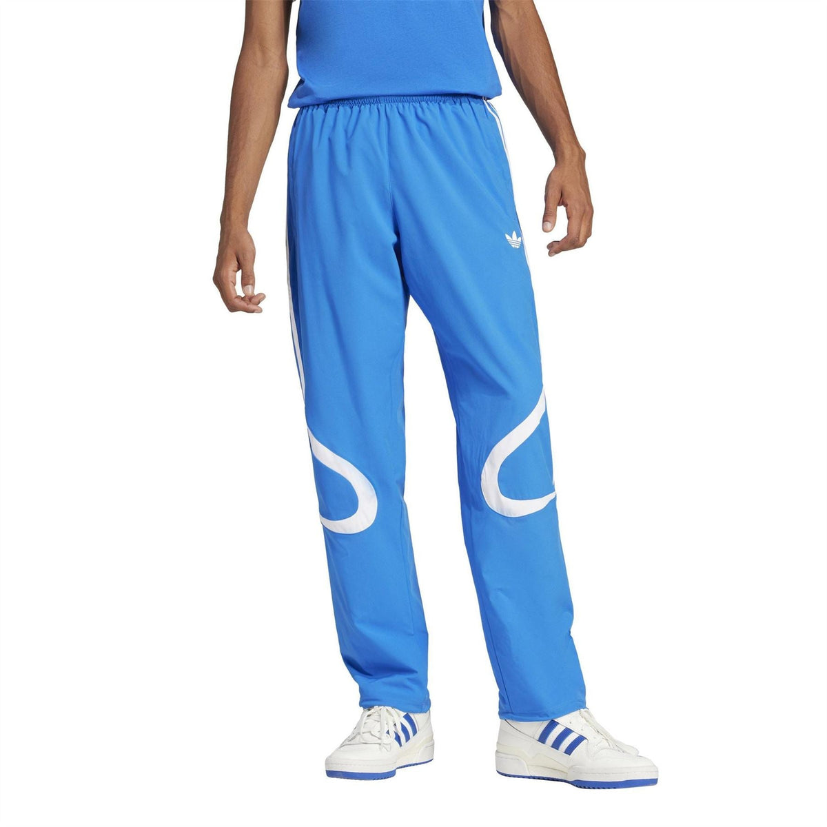 adidas Originals blue track pants with white side stripes and elastic cuffs