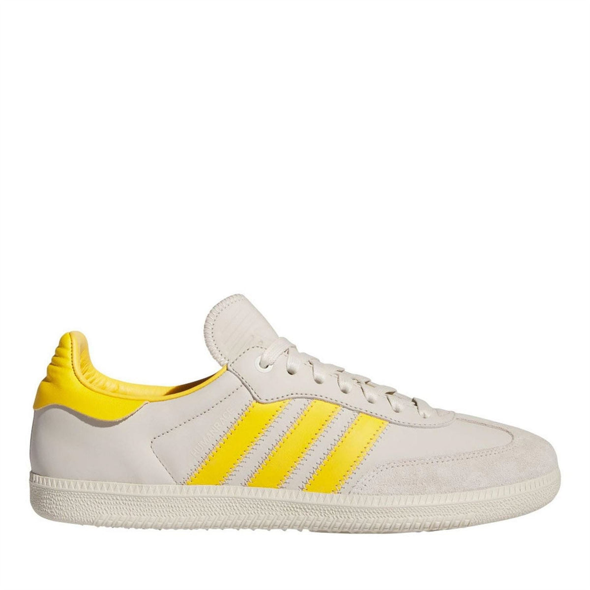 Leather low-top trainers in off-white with yellow side stripes and white laces