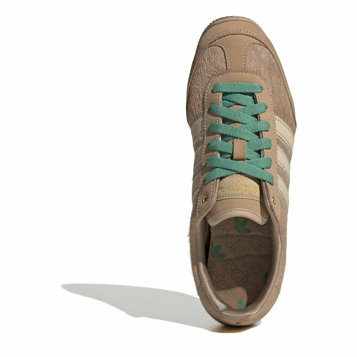 Brown Japan shoes with teal-green laces and adidas Japan tongue badge