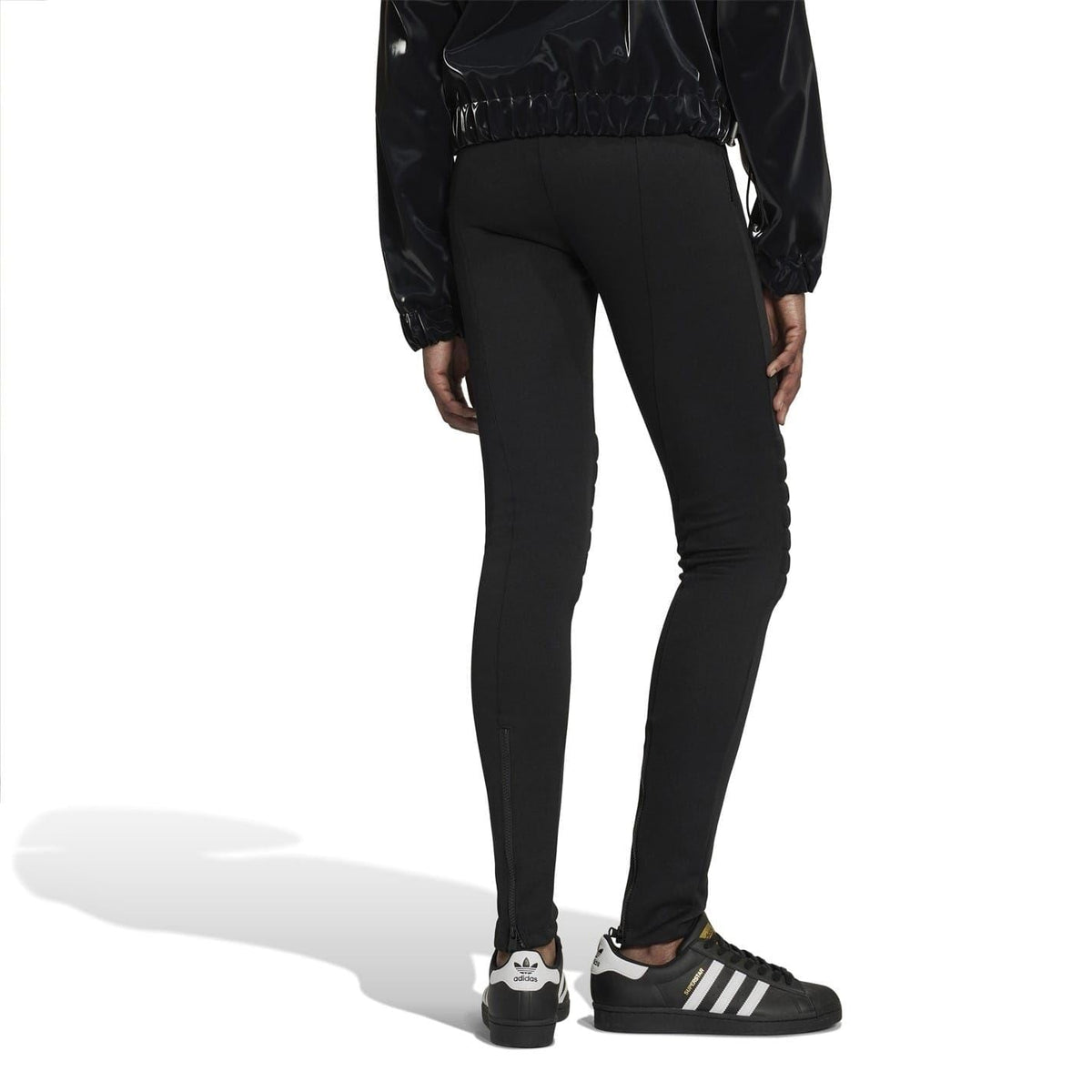 Black performance tights with tapered legs and quilted lower-leg design
