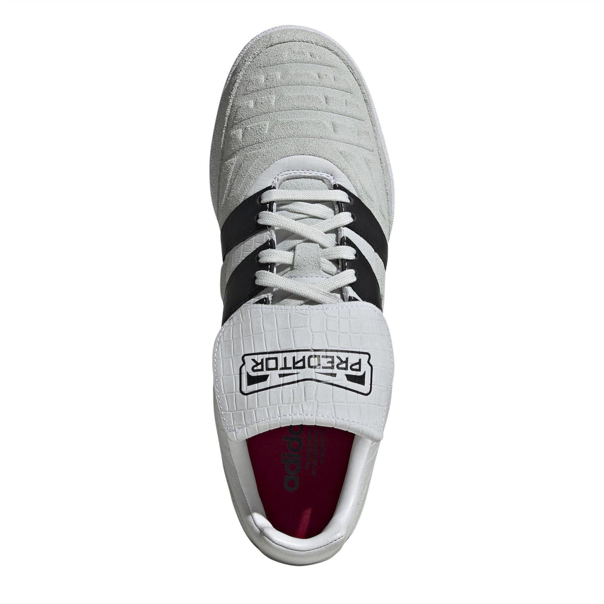 Low-top soccer cleat tongue and lace opening in gray with maroon Adidas lining