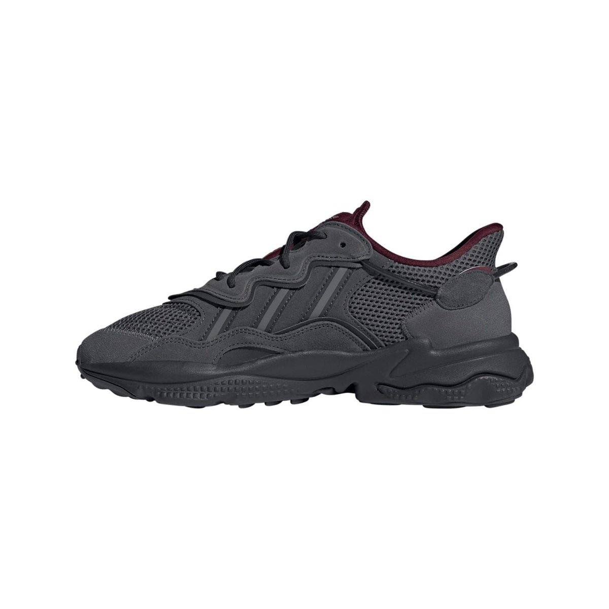 Grey lace-up trainer with burgundy collar trim and textured sole