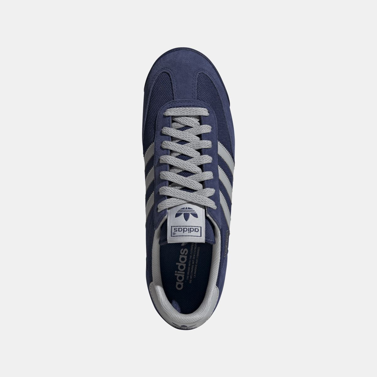 adidas Originals R71 shoes in white and black with retro design, showcasing the classic footwear style and brand logo.