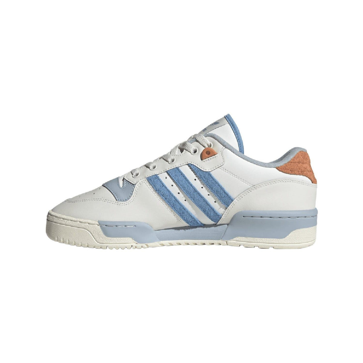 White low-top trainers with blue stripes, brown collar accent, and thick sole