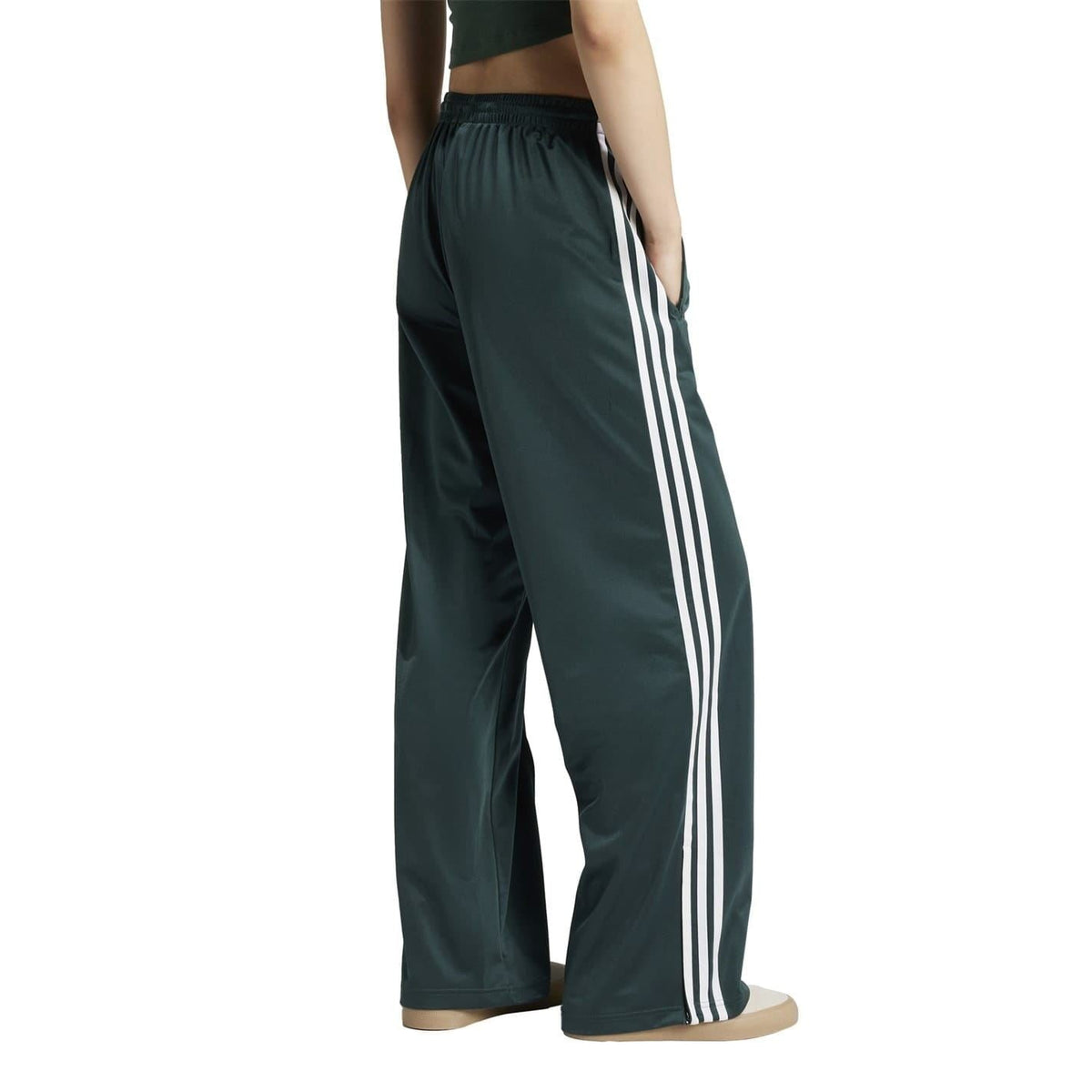 adidas Originals loose dark teal track pants with white side stripe accents and elastic waist