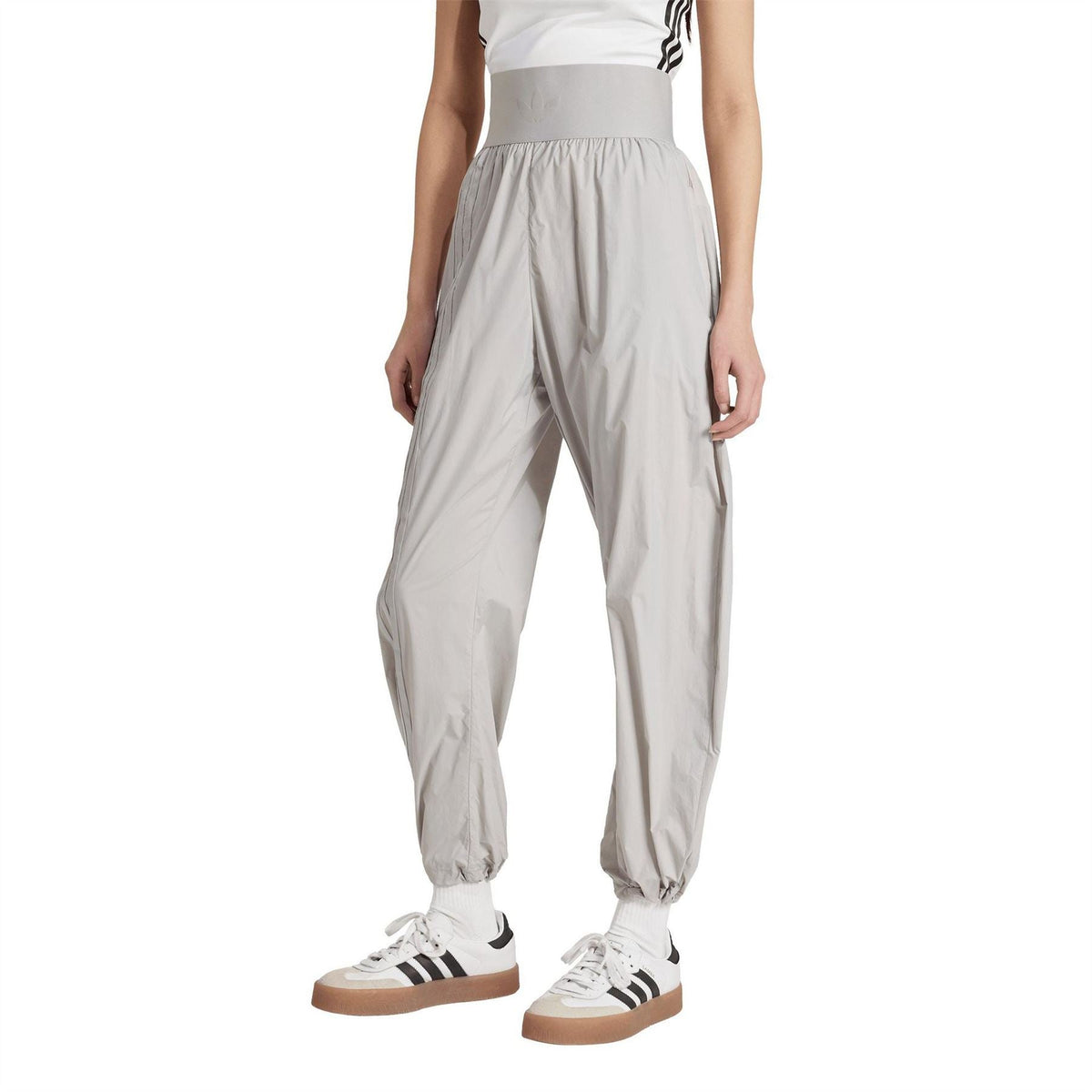 Light grey jogger pants with elastic waist, relaxed tapered legs, and cuffed ankles
