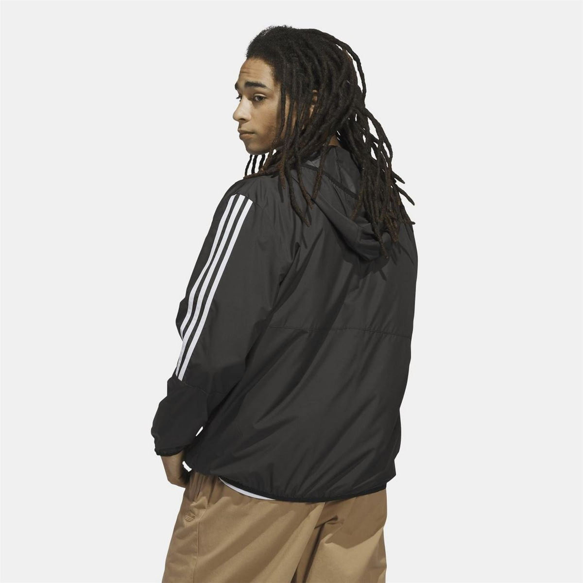 Black windbreaker jacket with hood and three white shoulder stripes