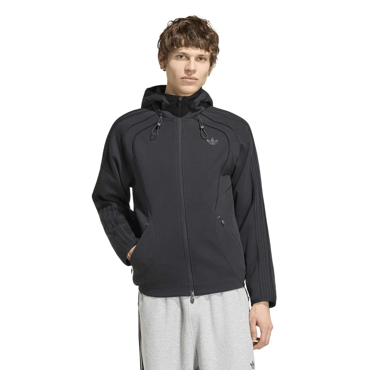 Black adidas Originals zip-up hoodie on model with hood up and front zipper