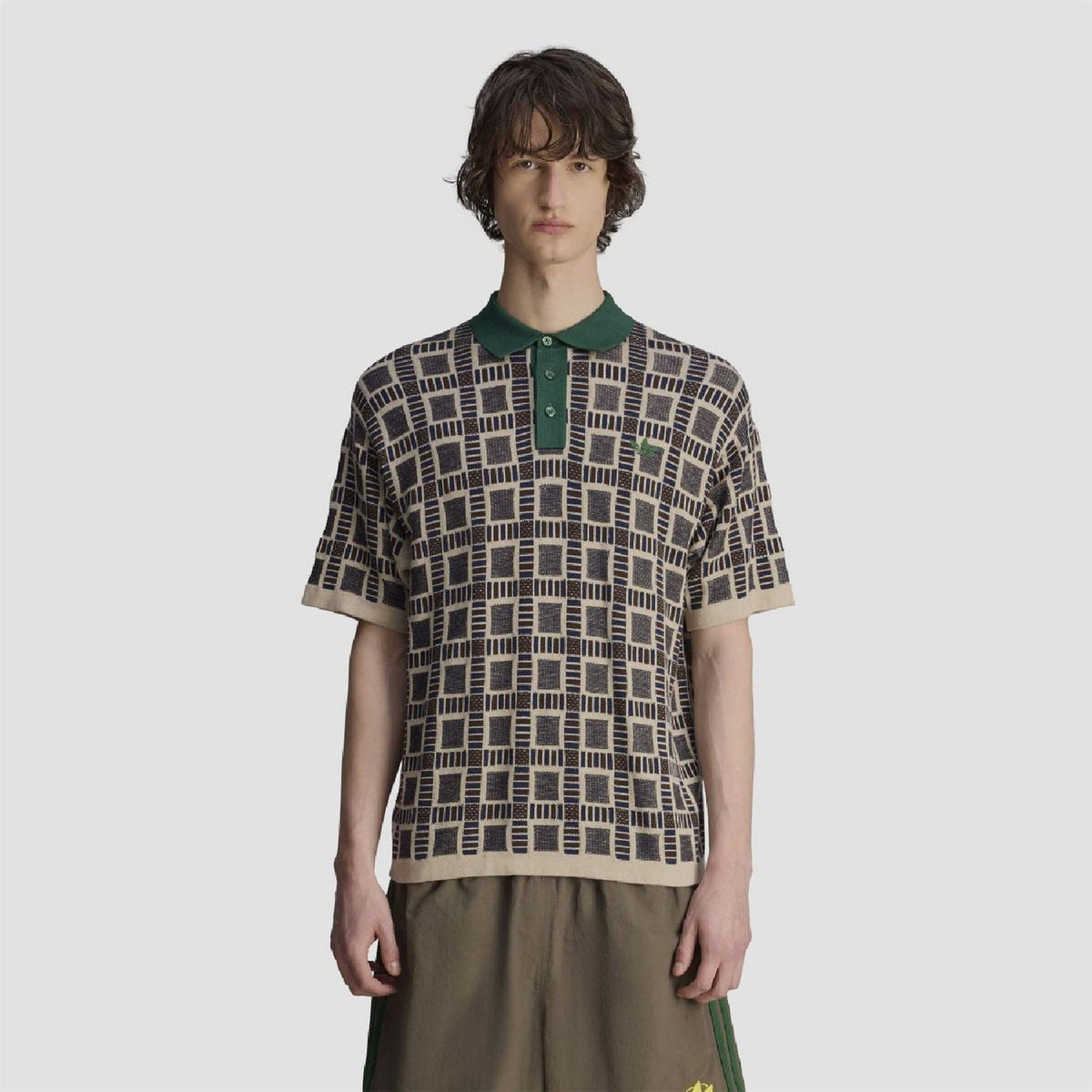 Men’s adidas Originals polo shirt with geometric print, green collar, short sleeves