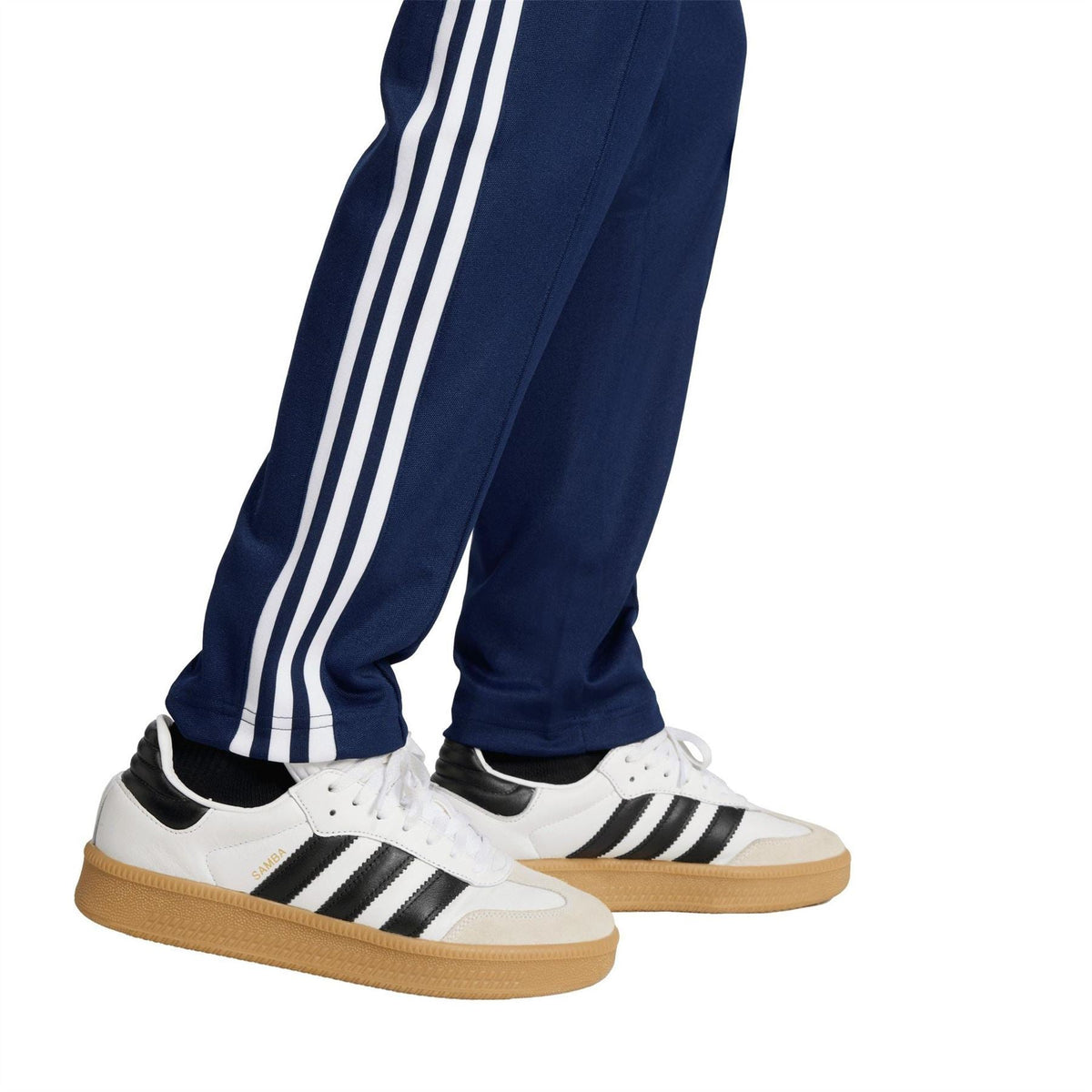Navy slim track pants with white triple side stripes and open cuff hems