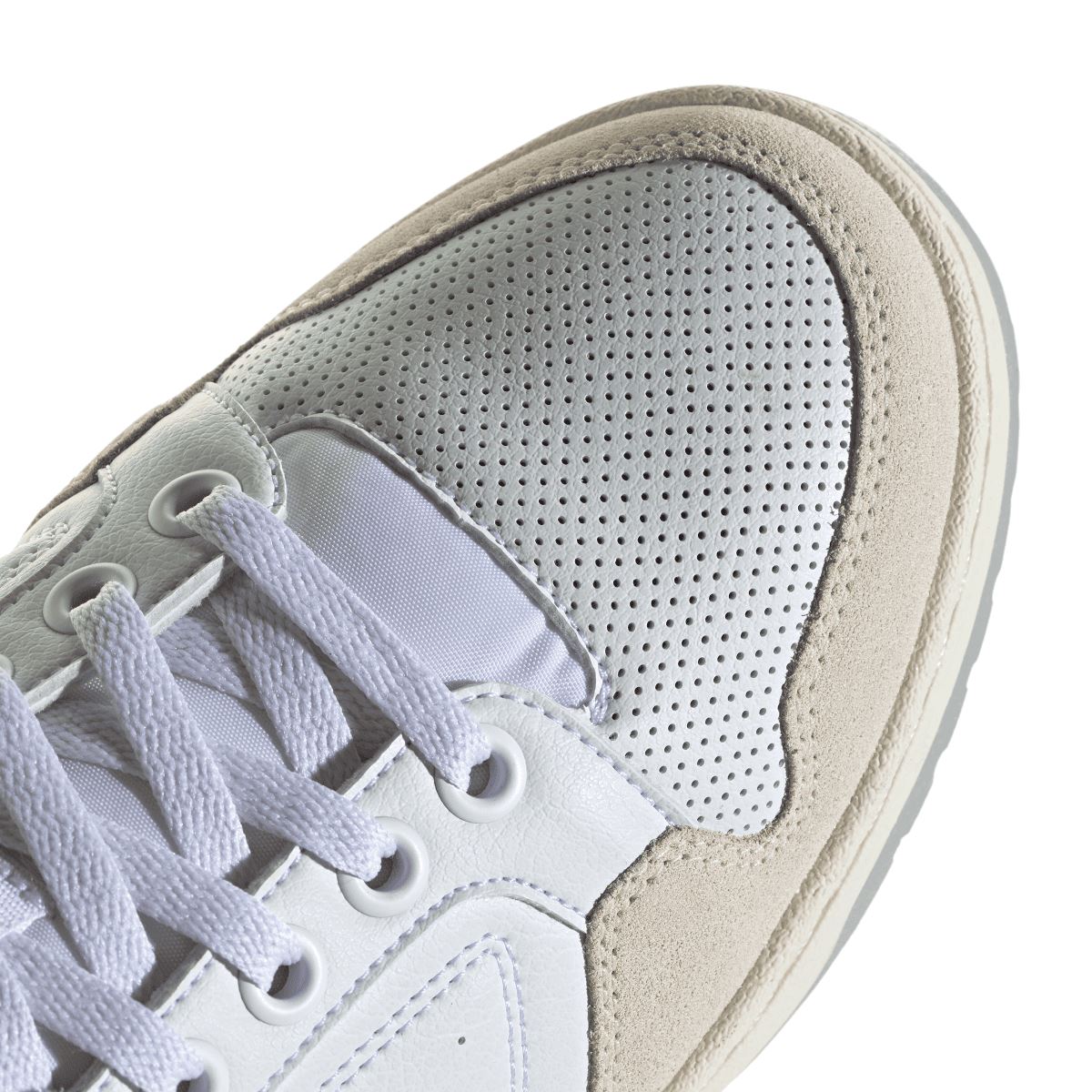 White adidas Originals NY 90 trainers close-up of perforated toe and textured sole