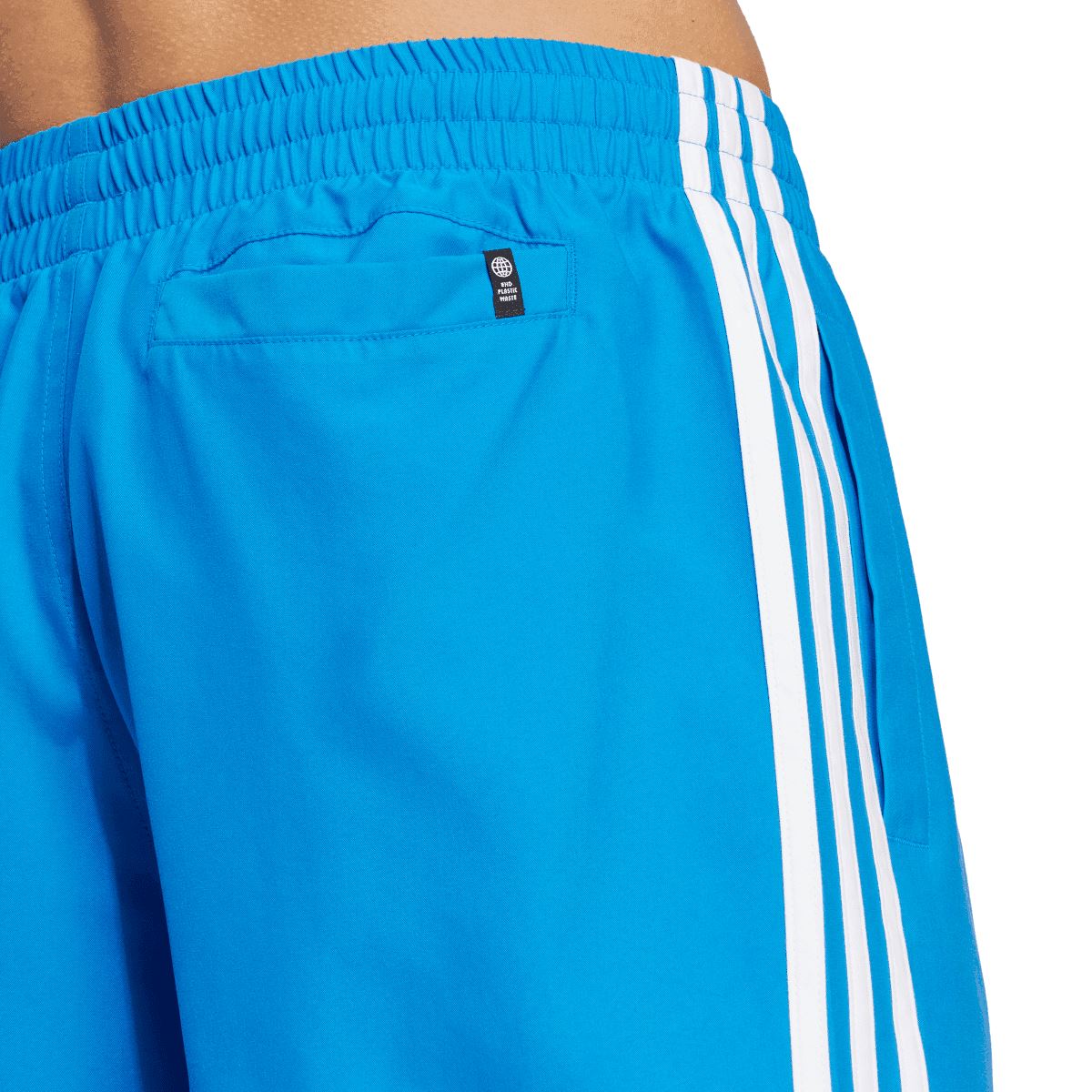 Blue adidas swim shorts with elastic waistband and small size label