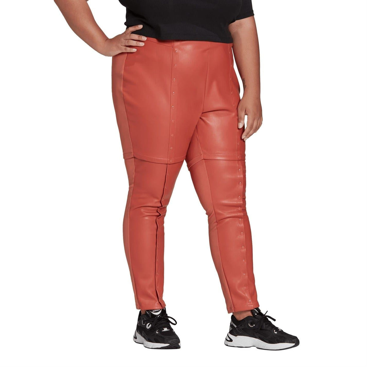 adidas slim-fit jogger sweatpants, rust-red front view with utility seams and buttons