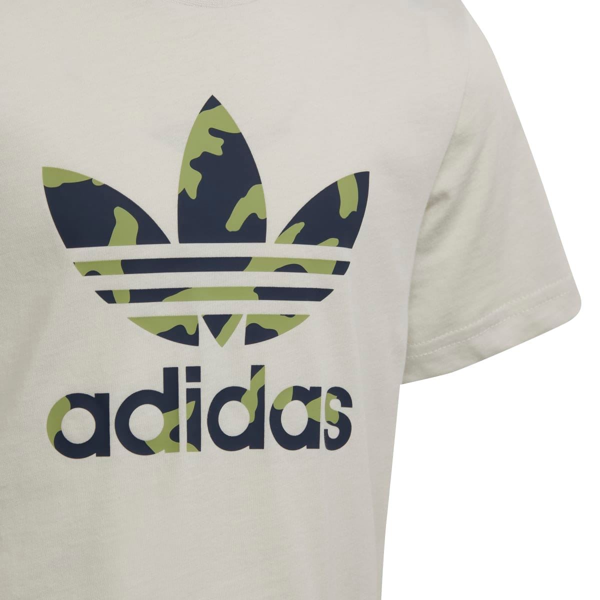 Close-up of camo adidas logo graphic on cream junior T-shirt