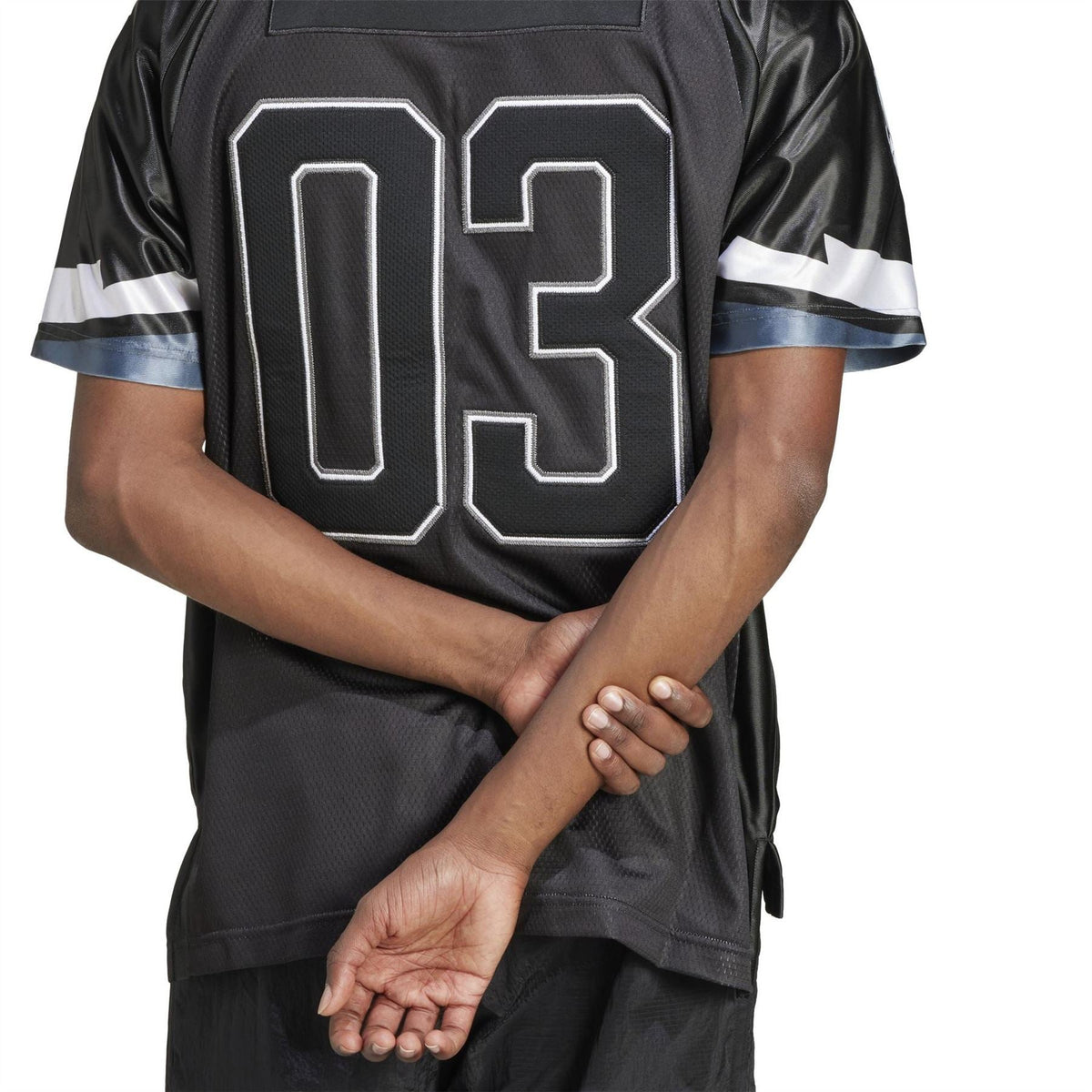Black jersey back with large white "03" number and lightning stripe sleeve details