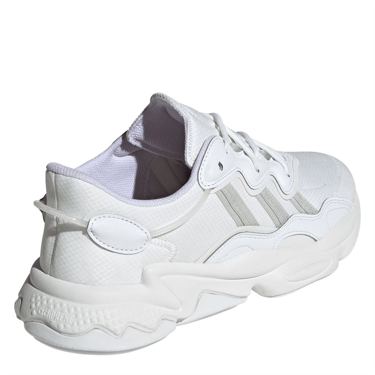 adidas Originals Ozweego low-top trainers featuring a sleek design with white and grey color accents and cushioned soles.