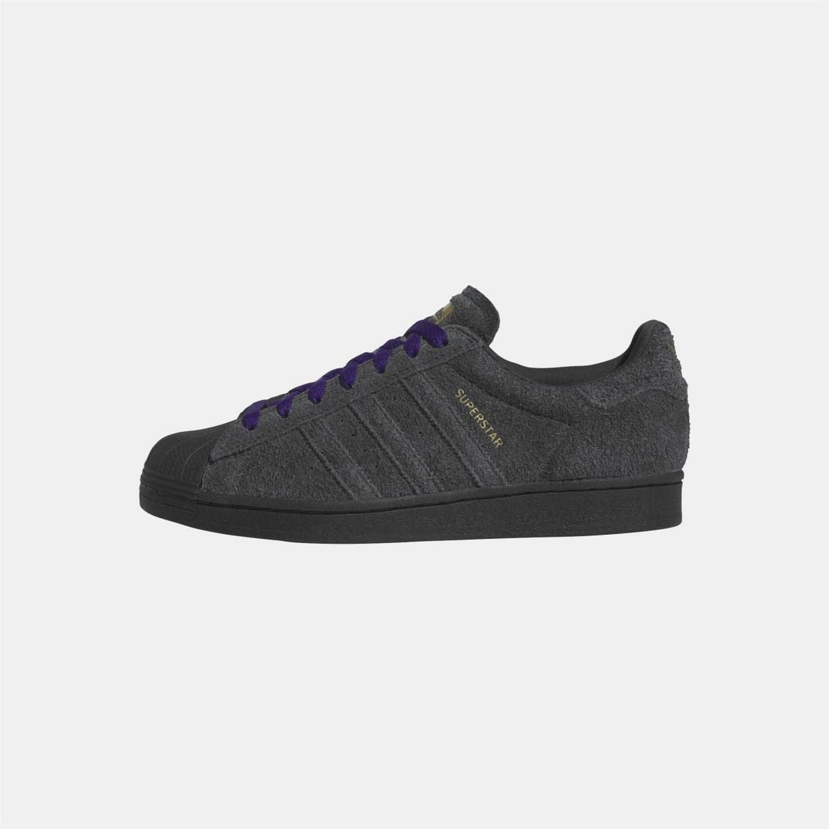 Black low-top sneakers with purple lace-up, side stripes, and textured upper