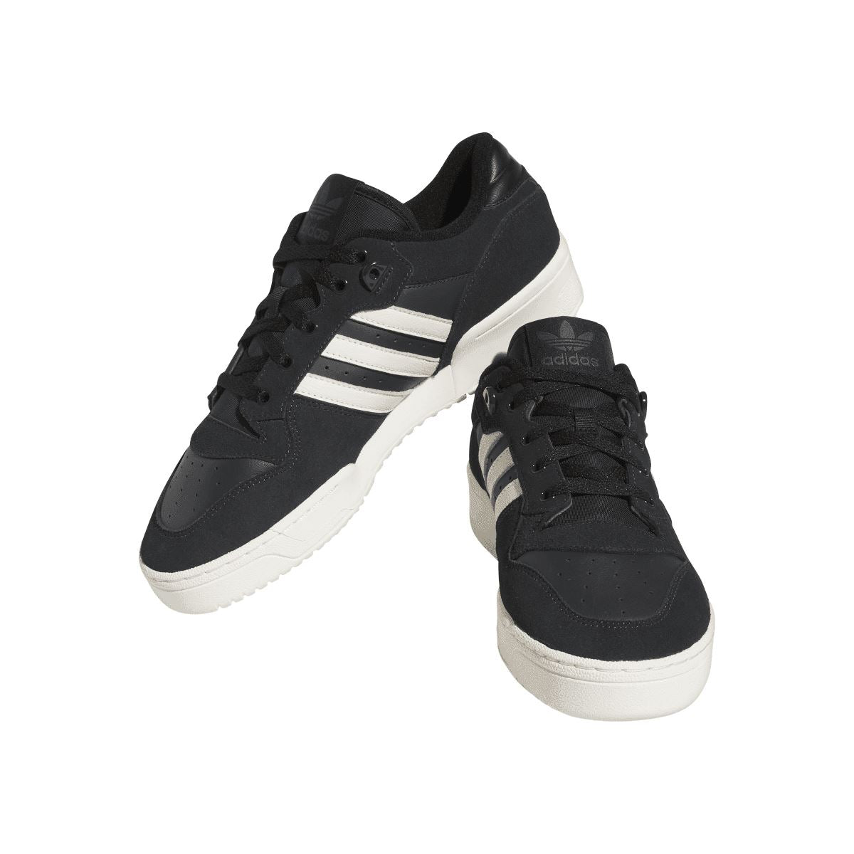 Black suede low-top trainers with white three stripes, lace-up closure, and white sole