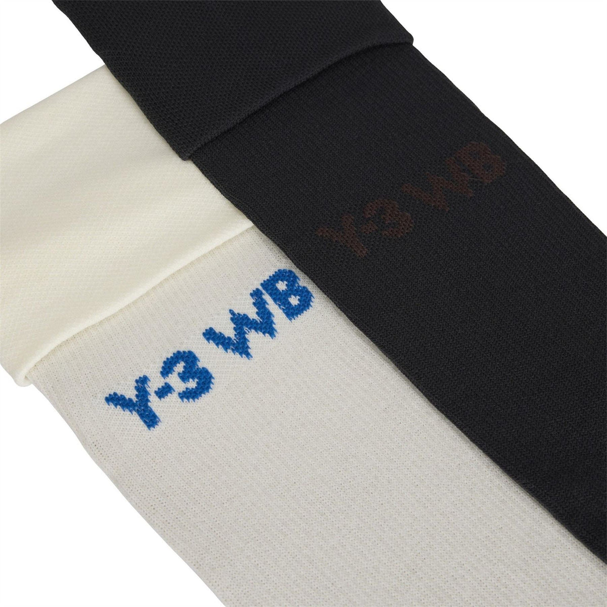 Crew socks close-up: off-white with blue Y-3 WBR text and black with orange print