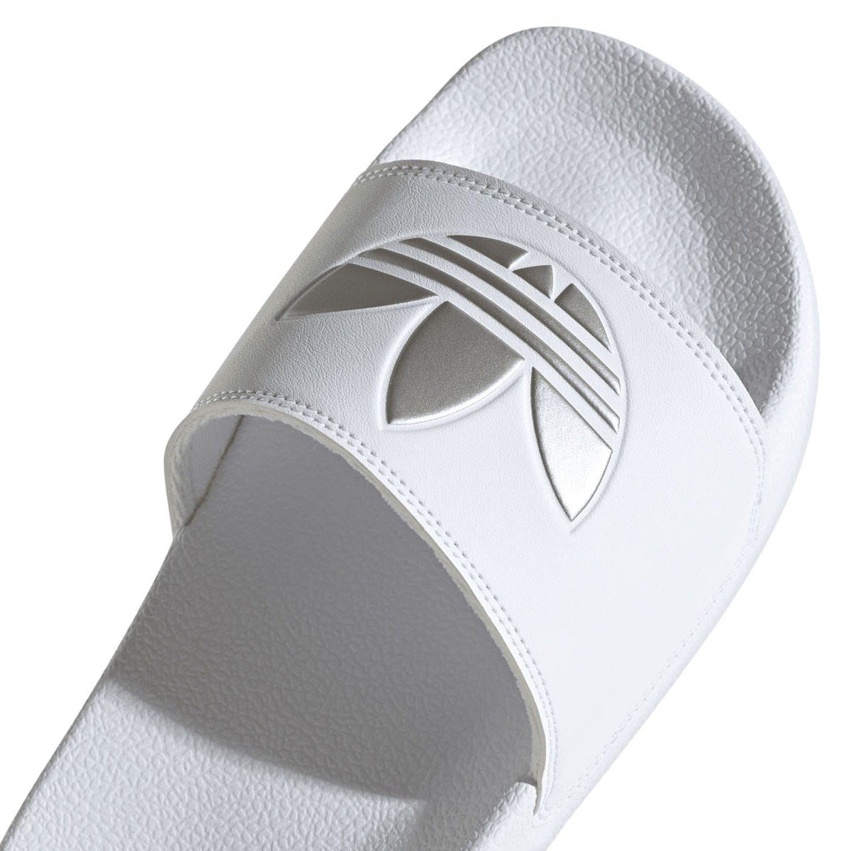 White adidas slide sandal upper with large Trefoil-style cutout logo