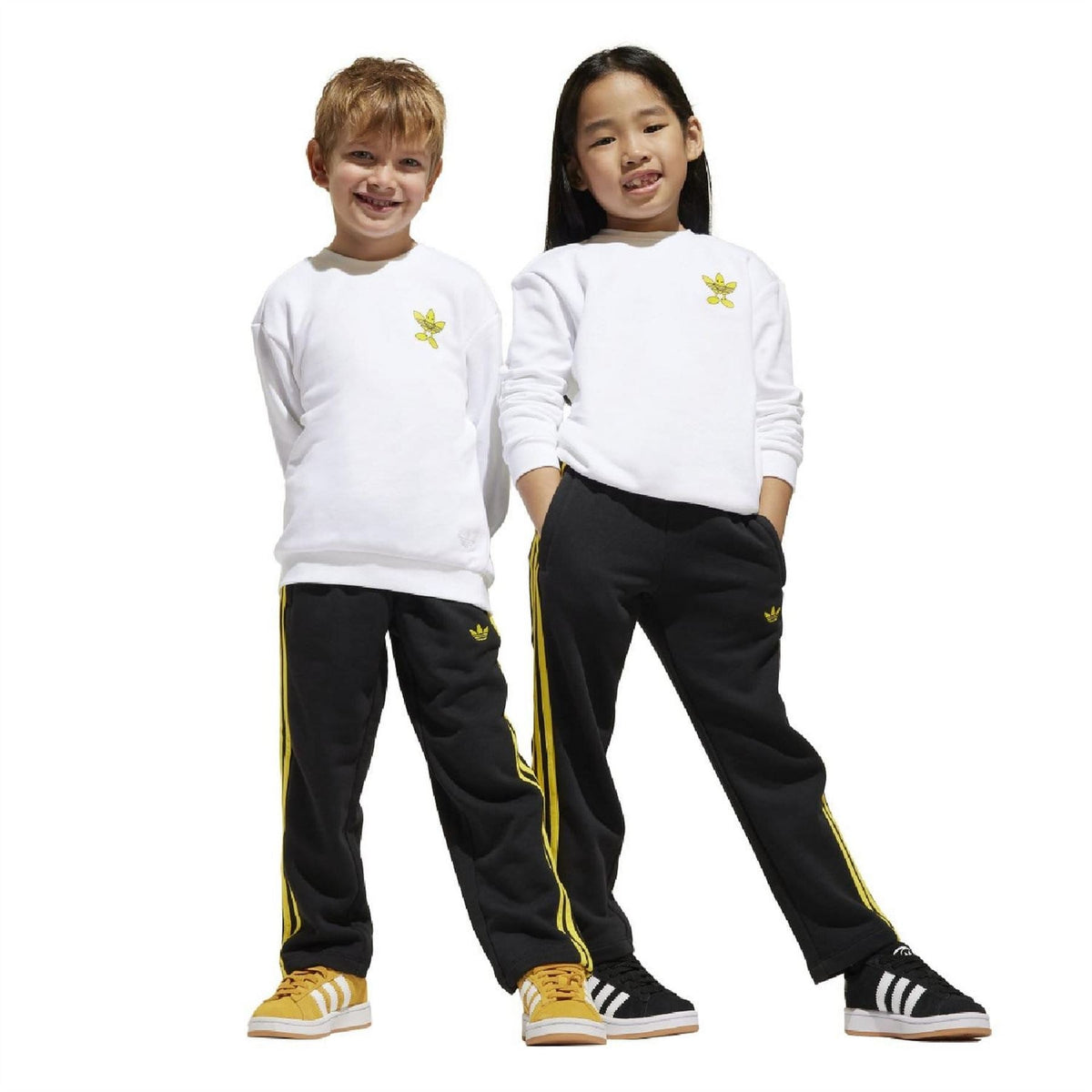 Kids crewneck sweatshirt and track pants set: white top with yellow logo, black pants with stripes