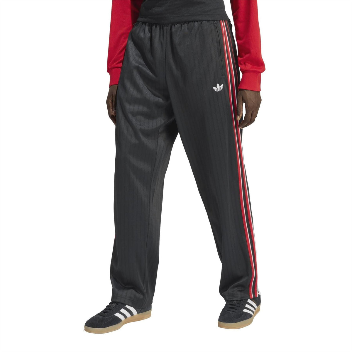 Black woven joggers with elastic waist and red-and-white triple side stripe