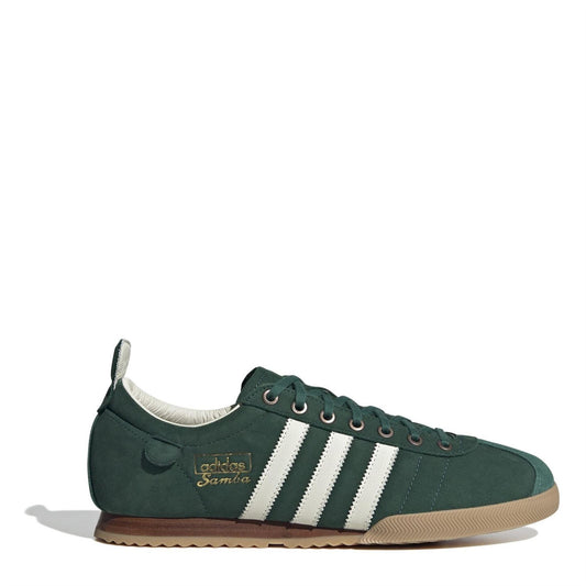 Green suede low-top sneakers with white three-stripe details and lace-up front