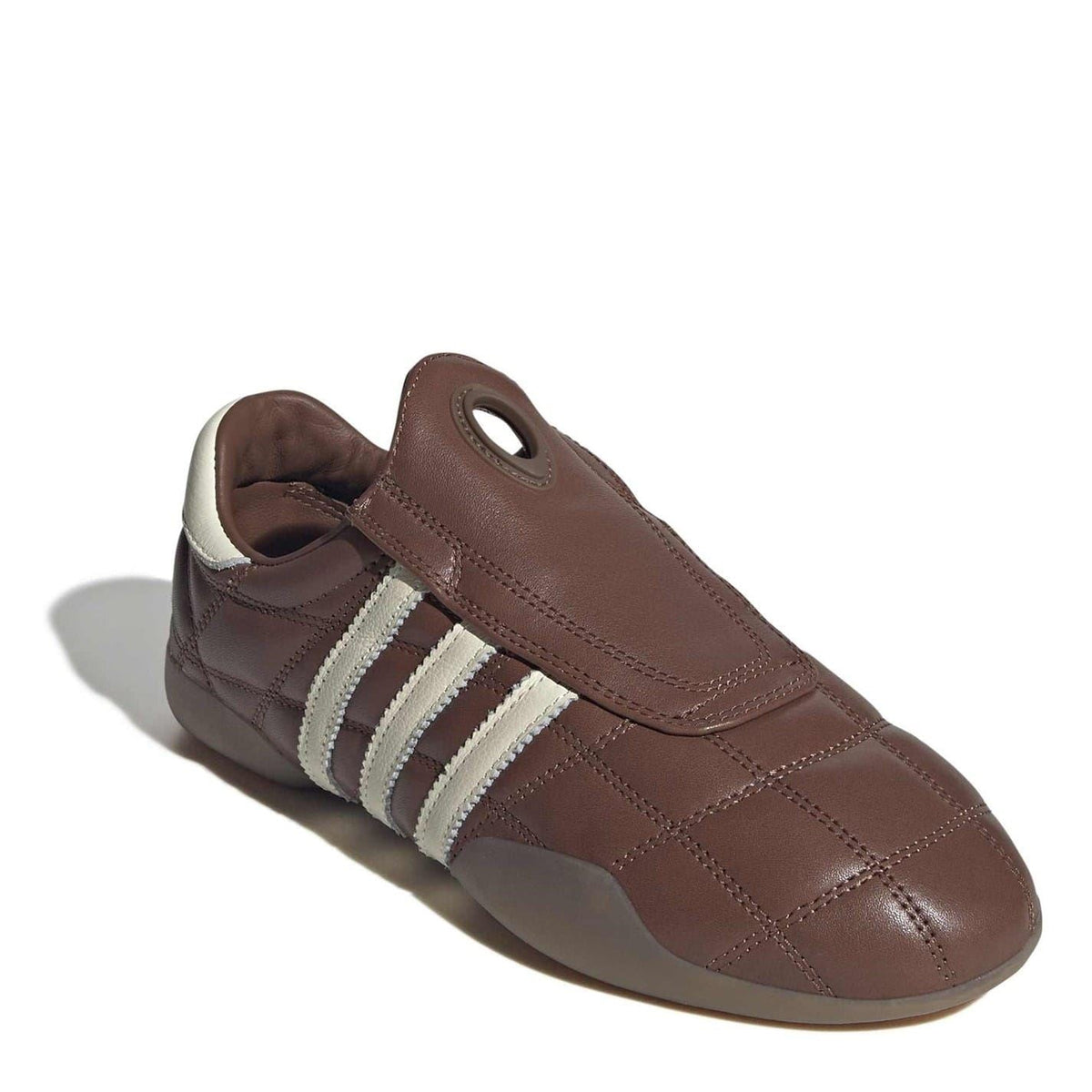 Brown adidas Originals low top sneakers with cream three-stripe panel and stitched detail.