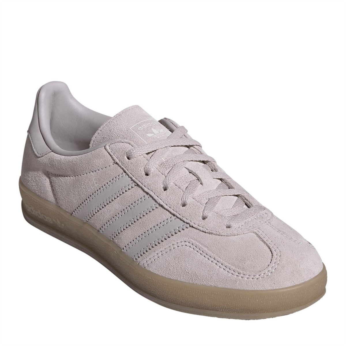Low-top suede trainers with lace-up closure, adidas stripes, and gum rubber sole.