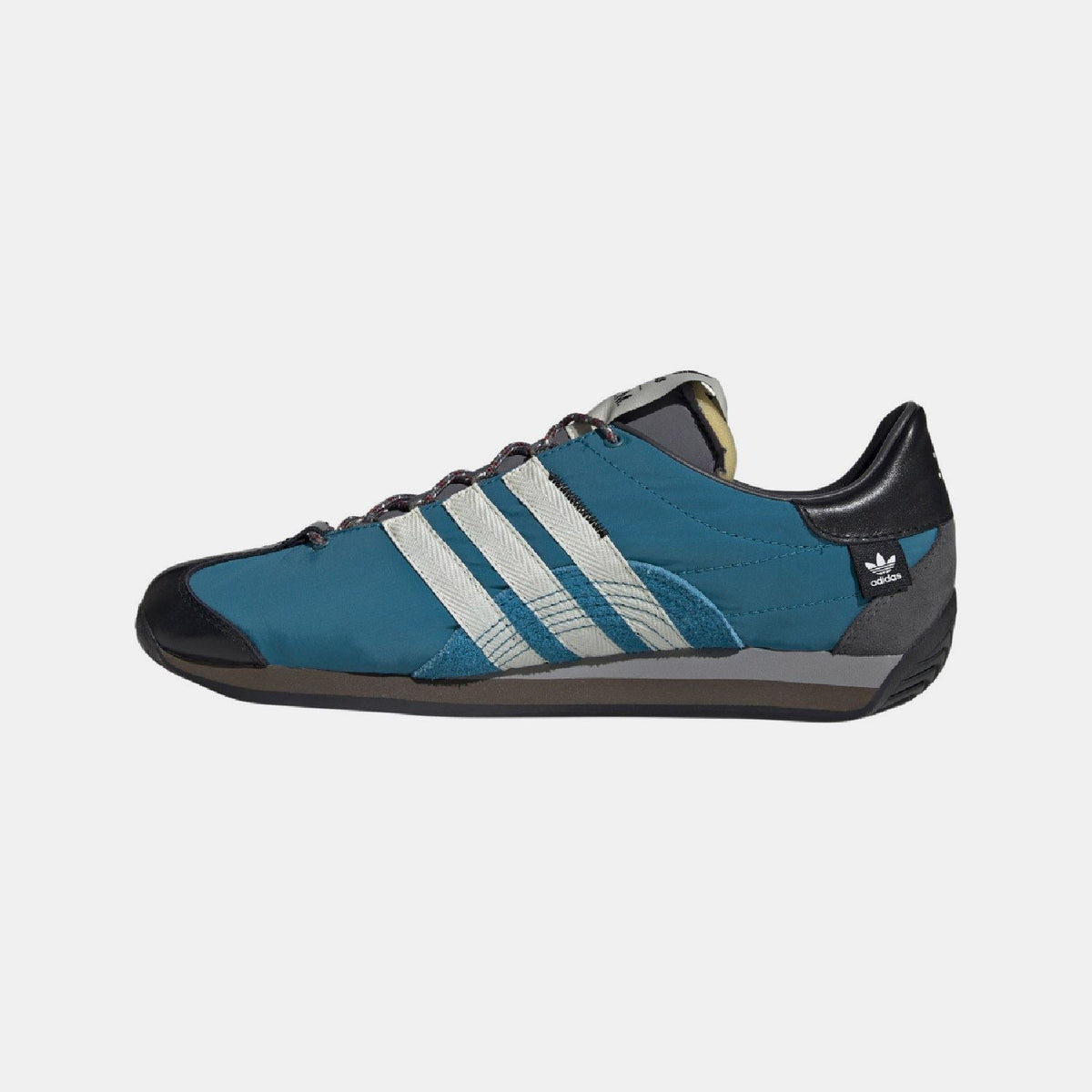 Teal and black low-top adidas Originals Country OG trainers with three stripe panels