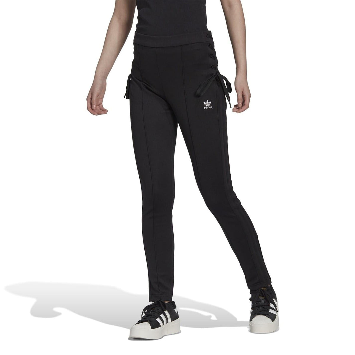 adidas Originals slim fit running joggers in black with tapered legs and athletic design, suitable for active sports and casual wear