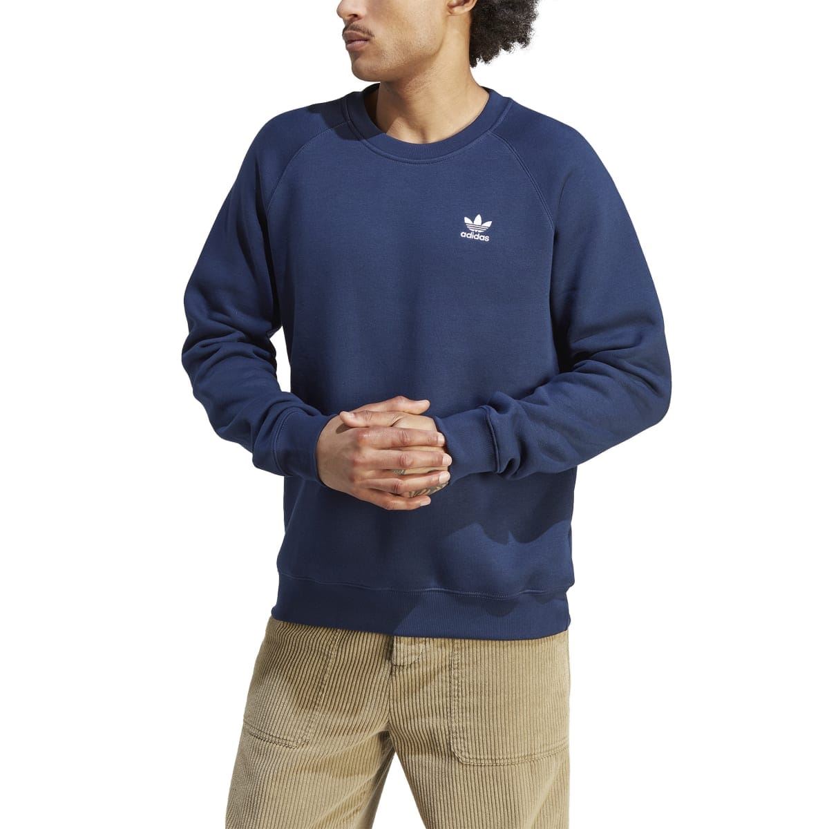 Navy crewneck sweatshirt with chest adidas trefoil logo, model front view