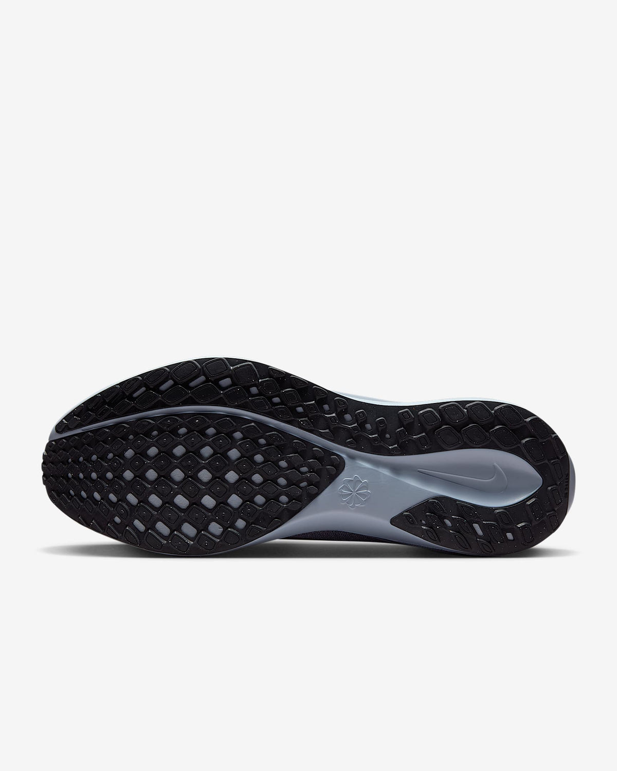 Black outsole with traction pattern and Air Zoom midsole on dark running shoe