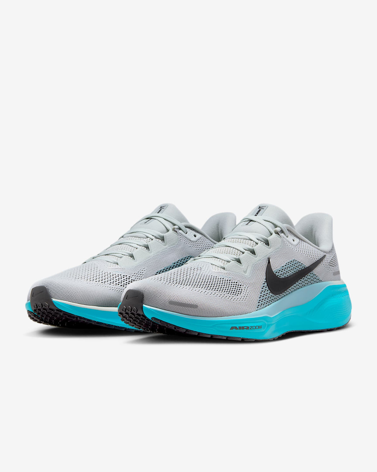 Gray running sneakers with black swoosh and bright teal outsole