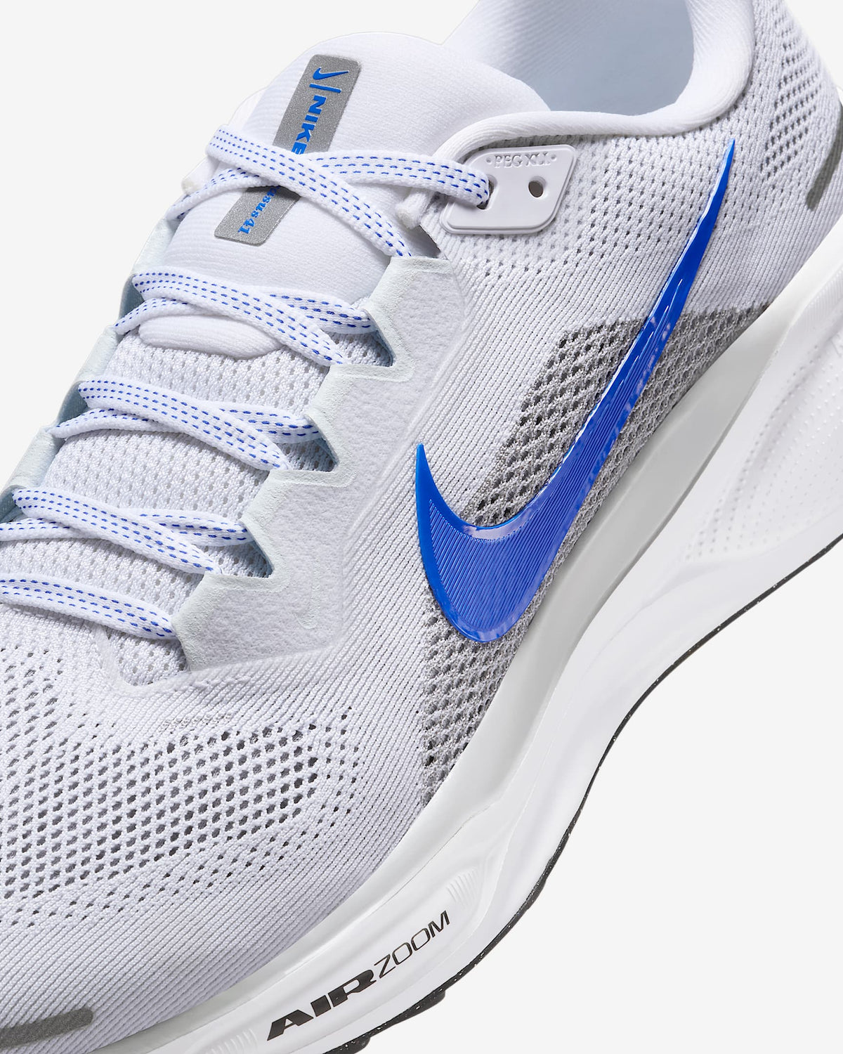Close-up of white Air Zoom Pegasus 41 upper with blue laces and swoosh logo