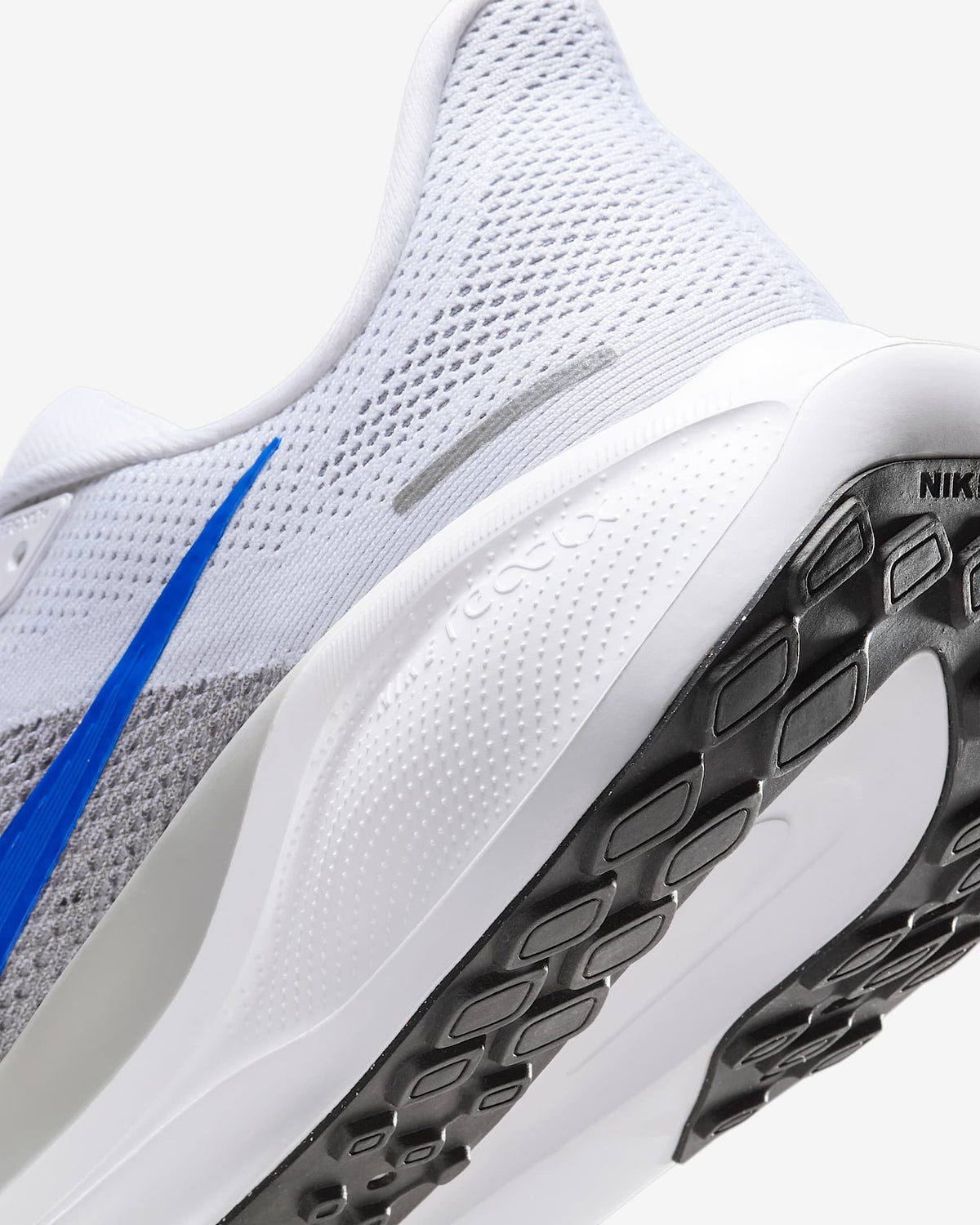 White Air Zoom Pegasus 41 shoe side with perforated upper and black traction outsole