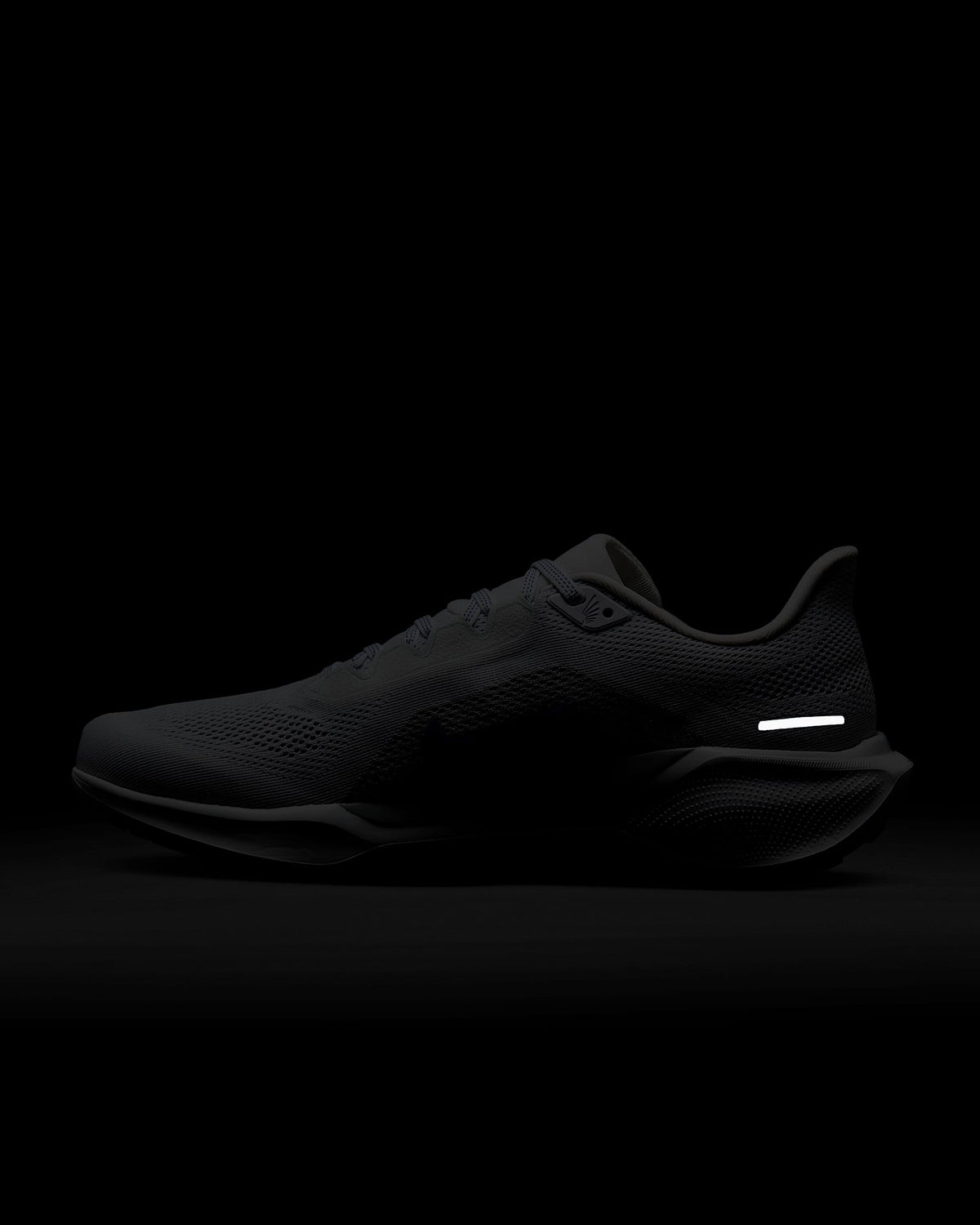Dark gray Air Zoom running shoe with mesh upper and contrasting swoosh logo