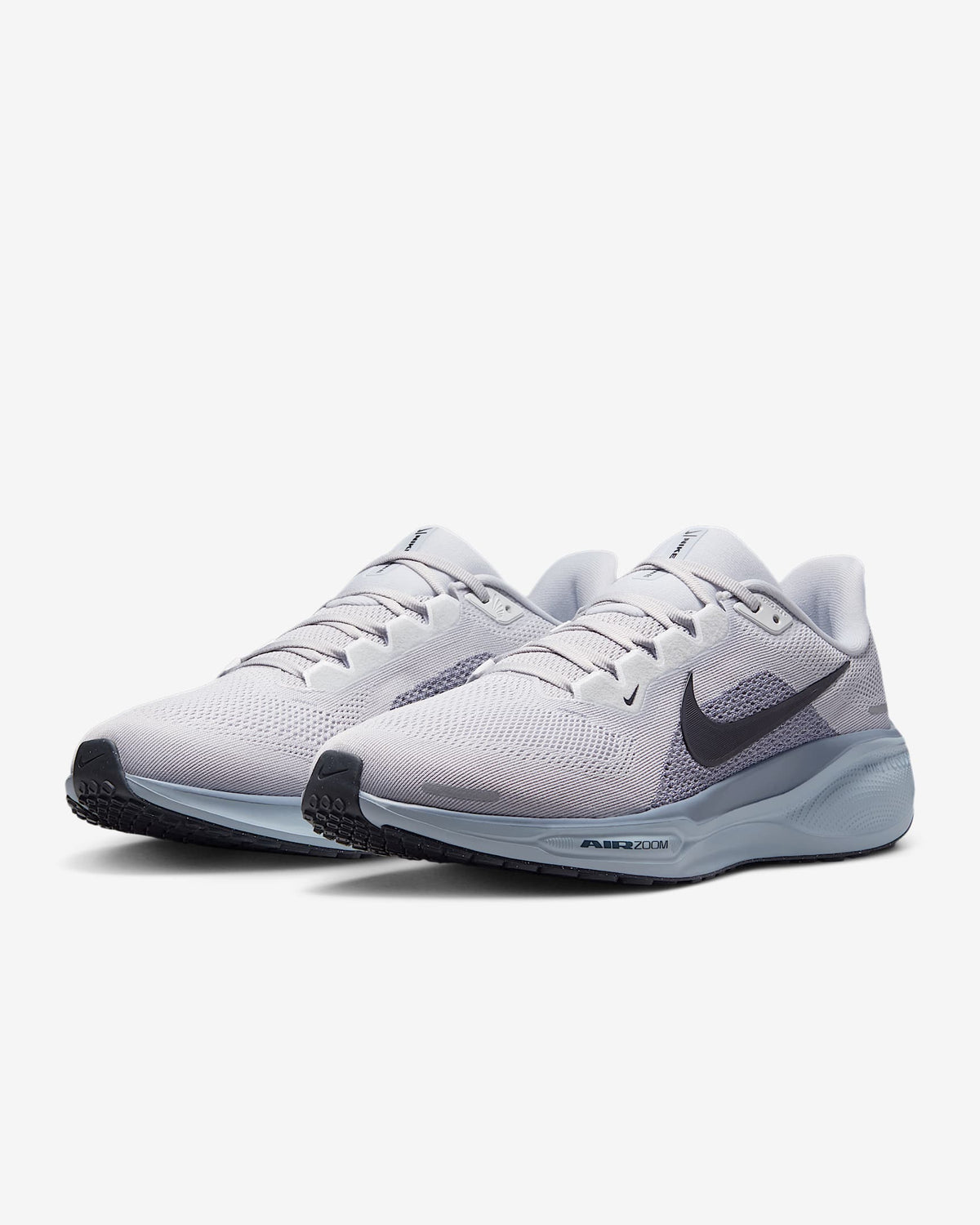 Light gray Air Zoom running shoes, dual pairs in mesh with dark swoosh logo