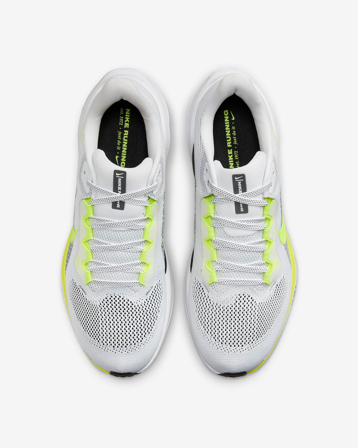 White running shoes with neon green laces and tongue logo