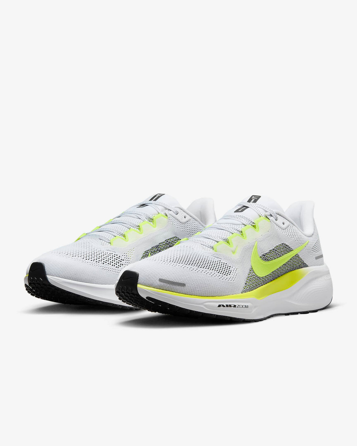 White running shoes with neon green swoosh, mesh upper, and black heel panel