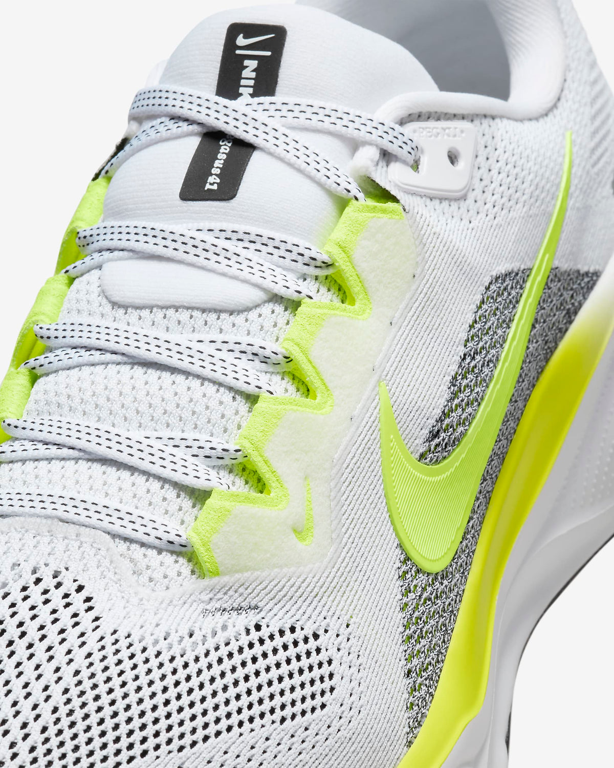 Pegasus 41 running shoes, white knit upper with neon green laces and swoosh.