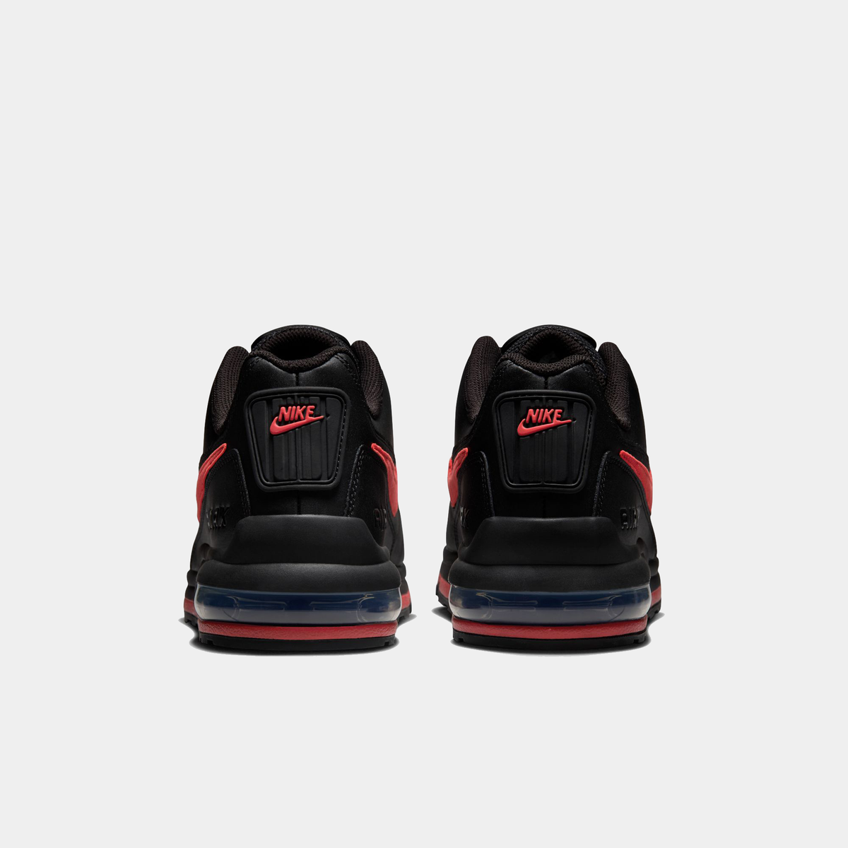 Black Air Max LTD 3 sneakers showing heels with red side accents