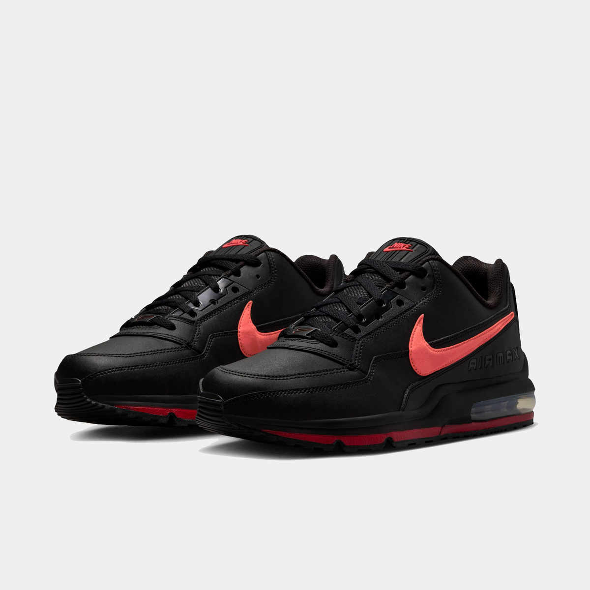 Pair of black Air Max LTD 3 sneakers with red accents and lace-up design