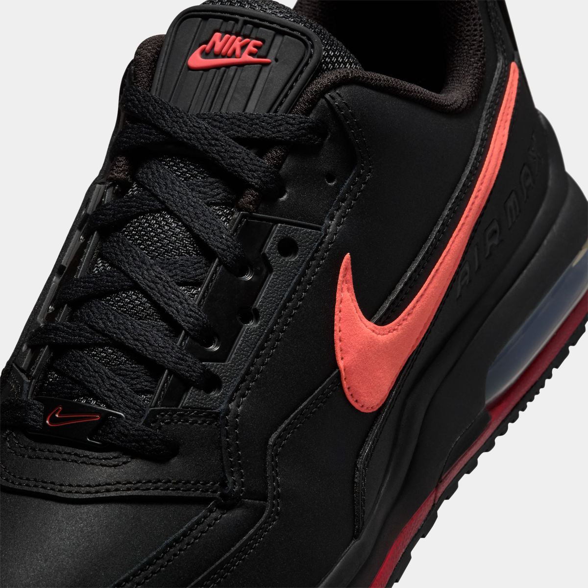 Close-up of black Air Max LTD 3 shoe with red swoosh and laces