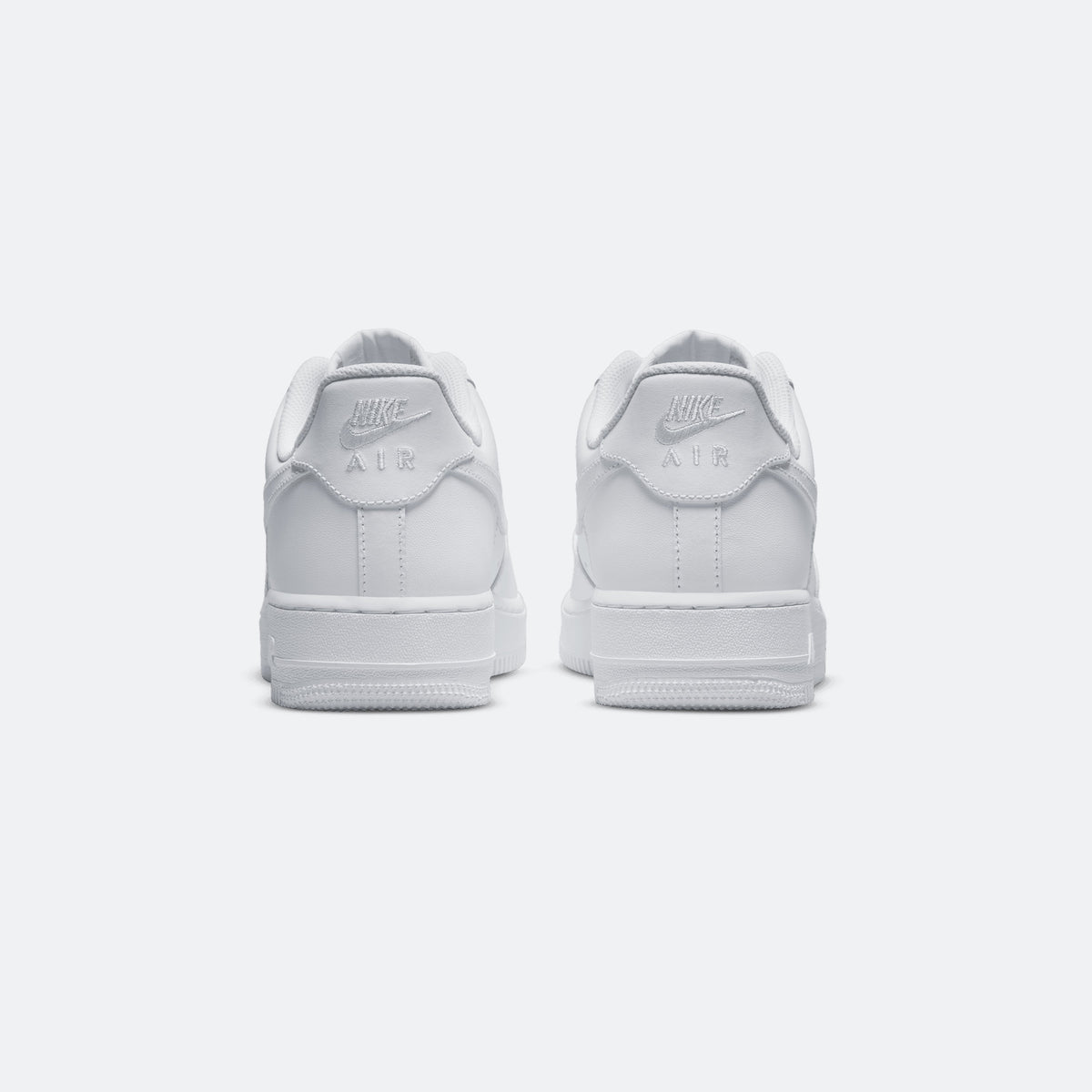 Nike Air Force 1 '07 triple white sneakers, rear view with Air branding on heel