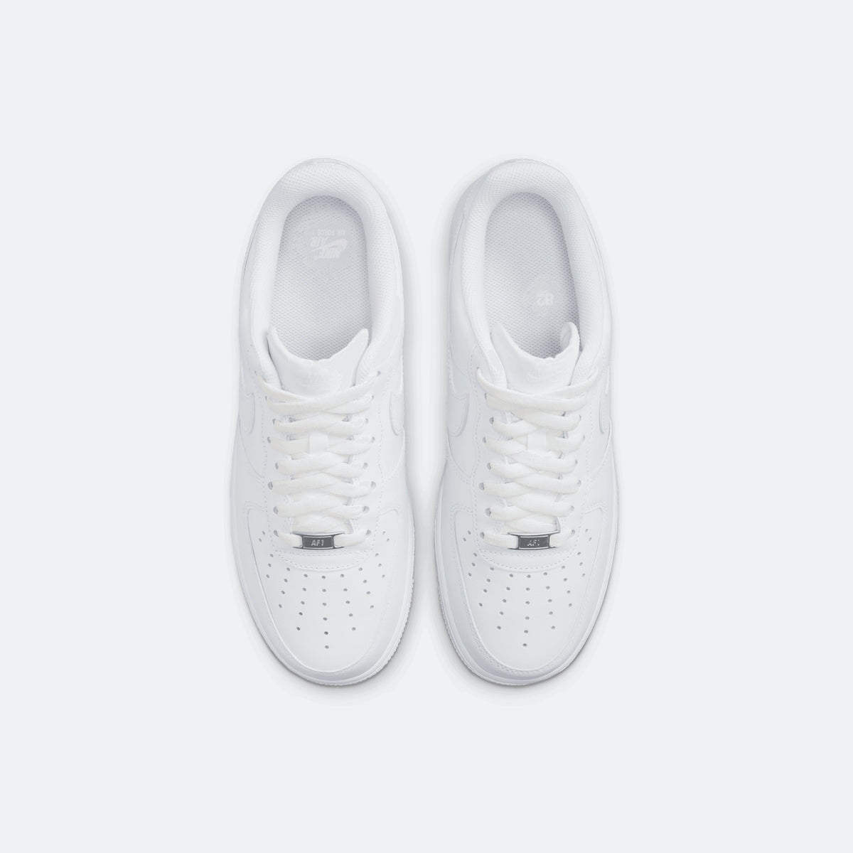 Nike Air Force 1 '07 triple white sneakers, top view of laced white leather pair